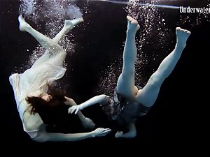 two dolls swim and get bare wondrous